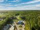 Aerial view of community pool, tennis courts, and clubhouse at 19907 Tattnall Way, Brooksville, FL 34601