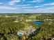 Aerial view of community amenities including pool and tennis courts at 19907 Tattnall Way, Brooksville, FL 34601