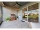 Outdoor kitchen and patio with stylish tile and string lights at 19907 Tattnall Way, Brooksville, FL 34601