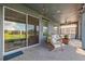 Relaxing covered patio with outdoor furniture and string lights at 19907 Tattnall Way, Brooksville, FL 34601