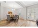 Round dining table with six chairs and art on the wall at 19907 Tattnall Way, Brooksville, FL 34601