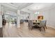 Bright dining room with a round table and six chairs, open to Gathering room at 19907 Tattnall Way, Brooksville, FL 34601
