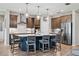 Gourmet kitchen with large island, stainless steel appliances, and ample cabinet space at 19907 Tattnall Way, Brooksville, FL 34601