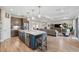 Open kitchen with large island and stainless steel appliances at 19907 Tattnall Way, Brooksville, FL 34601