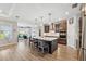 Modern kitchen with large island and stainless steel appliances at 19907 Tattnall Way, Brooksville, FL 34601