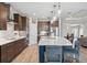 Modern kitchen with stainless steel appliances and large island at 19907 Tattnall Way, Brooksville, FL 34601