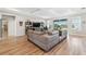 Spacious living room with large sectional sofa and views to backyard at 19907 Tattnall Way, Brooksville, FL 34601
