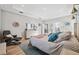Luxurious main bedroom with ample space, featuring a dresser and relaxing seating area at 19907 Tattnall Way, Brooksville, FL 34601