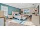 Spacious main bedroom with plush bedding, a neutral color palette, and an ensuite bathroom at 19907 Tattnall Way, Brooksville, FL 34601