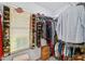 Well-organized walk-in closet with shelving and hanging rods at 19907 Tattnall Way, Brooksville, FL 34601