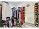 Spacious walk-in closet with ample hanging space and shoe storage at 19907 Tattnall Way, Brooksville, FL 34601