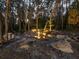 Relaxing outdoor water feature nestled among trees at dusk at 21340 Powell Rd, Brooksville, FL 34604