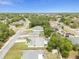 Aerial view of residential neighborhood with houses and trees at 2468 Magellan Ave, Spring Hill, FL 34608