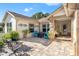 Inviting front porch with paver patio, seating area, and landscaping at 3015 Saw Mill Ln, Spring Hill, FL 34606