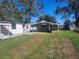 Large backyard with shed and carport at 36343 5 Acre Ln, Zephyrhills, FL 33541