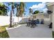 Concrete patio with seating for outdoor dining at 5013 Tammy Ln, Holiday, FL 34690