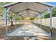 Covered carport provides parking and shade at 5216 Frost Rd, Spring Hill, FL 34606