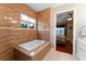 Bathroom with soaking tub and view into bedroom at 6128 Evening Ray Dr, Brooksville, FL 34601