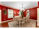 Elegant dining room with a large table and chandelier at 6128 Evening Ray Dr, Brooksville, FL 34601