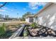 Landscaped front yard with stone border and various plants at 6280 Hancock Ave, Spring Hill, FL 34608