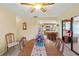 Bright dining room with table and chairs, open to kitchen at 6312 Darien Way, Spring Hill, FL 34606