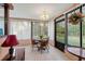 Bright sunroom with table and chairs, offering garden views at 6312 Darien Way, Spring Hill, FL 34606