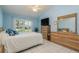 Main bedroom with a king-size bed and plenty of natural light at 6604 Rosemont Ct, New Port Richey, FL 34655