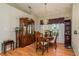 Bright dining room featuring a wooden table and hutch at 6604 Rosemont Ct, New Port Richey, FL 34655