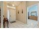 Bright entryway with tiled floor and view into the bedroom at 6604 Rosemont Ct, New Port Richey, FL 34655