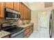 Well-equipped kitchen with granite countertops and ample cabinet space at 6604 Rosemont Ct, New Port Richey, FL 34655