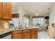 Spacious kitchen with granite countertops and modern appliances at 6604 Rosemont Ct, New Port Richey, FL 34655