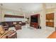 Spacious living room with leather sectional sofa and wood furniture at 6604 Rosemont Ct, New Port Richey, FL 34655