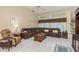Relaxing living room featuring a large leather sectional sofa at 6604 Rosemont Ct, New Port Richey, FL 34655
