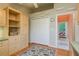 Home office features built-in shelving and cabinets, offering ample storage at 6604 Rosemont Ct, New Port Richey, FL 34655