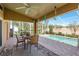 Relaxing screened-in pool area with patio furniture at 6604 Rosemont Ct, New Port Richey, FL 34655