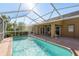 Large, refreshing, screened-in pool with patio at 6604 Rosemont Ct, New Port Richey, FL 34655