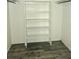 Large walk-in closet with built-in shelving and wood-look floors at 8632 Tahoe Ct # 7, Tampa, FL 33614