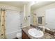 Clean bathroom with tub shower combo, vanity, and granite countertop at 9050 Pemberton St, Spring Hill, FL 34608