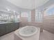 Bathroom features a large soaking tub and granite countertops at 10307 Ridge Top Loop, Weeki Wachee, FL 34613