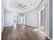 Primary bedroom with wood-look floors and bathroom access at 10307 Ridge Top Loop, Weeki Wachee, FL 34613