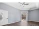 Primary bedroom with wood-look floors and access to the pool at 10307 Ridge Top Loop, Weeki Wachee, FL 34613