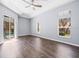 Bedroom with wood-look floors and sliding doors to the pool at 10307 Ridge Top Loop, Weeki Wachee, FL 34613