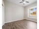 Bright bedroom with wood-look floors and large window at 10307 Ridge Top Loop, Weeki Wachee, FL 34613