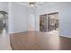 Bright Gathering room with wood-look floors and pool view at 10307 Ridge Top Loop, Weeki Wachee, FL 34613