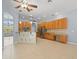 Kitchen features wood cabinets, granite counters, and stainless steel appliances at 10307 Ridge Top Loop, Weeki Wachee, FL 34613