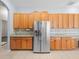 Kitchen features stainless steel appliances and wood cabinets at 10307 Ridge Top Loop, Weeki Wachee, FL 34613