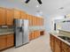 Kitchen with stainless steel appliances and wood cabinets at 10307 Ridge Top Loop, Weeki Wachee, FL 34613