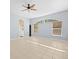 Light-filled living room with tile floors and neutral walls at 10307 Ridge Top Loop, Weeki Wachee, FL 34613
