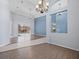 Living room with wood-look floors, ceiling fan, and sliding doors to the pool at 10307 Ridge Top Loop, Weeki Wachee, FL 34613