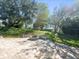 Spacious patio with fire pit and grassy backyard at 10307 Ridge Top Loop, Weeki Wachee, FL 34613
